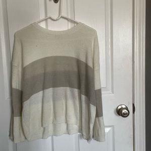 Grey and cream colored sweater